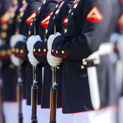 Marine Corps standing in line with guns