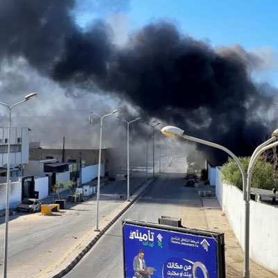 Smoke rising from a neighborhood following clashes in Tripoli
