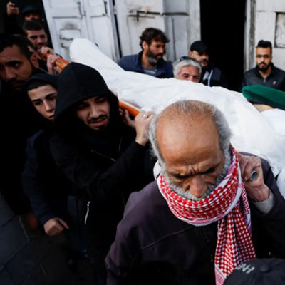Mourners carrying the body of Naseem Abu Fuda