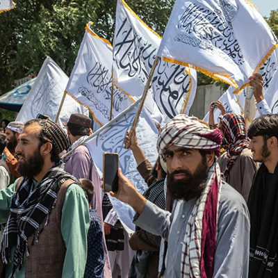 Supporters of the Taliban gather in front of the U.S. Embassy on August 2024