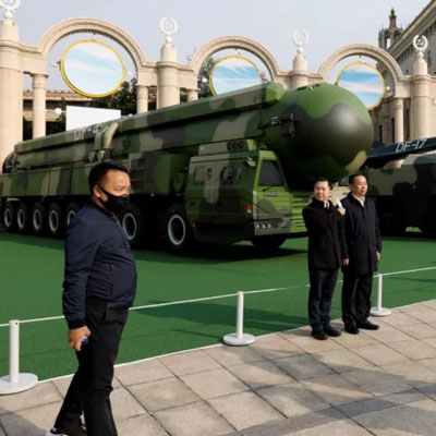Posing with nuclear missiles in Beijing