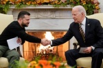 Joe Biden shakes hands with Ukrainian President Volodymyr Zelenskyy as they meet in the Oval Office