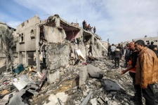 Palestinians carry out search and rescue operations among rubble after Israeli airstrikes
