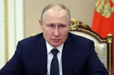 Russian President Vladimir Putin chairs a Security Council meeting via a video link in Moscow