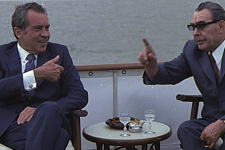 37th U.S. President Richard Nixon having a discussion with a political figure.