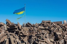 Ukraine flag flying over rocks