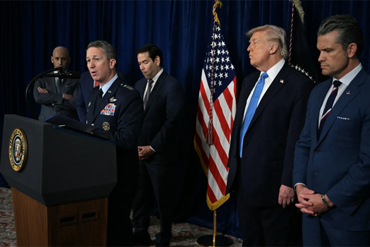 US President Donald Trump (2R) looks on as Chairman of the Joint Chiefs of Staff General Dan Caine (2L) speaks to the press following US military actions in Venezuela, at Trump's Mar-a-Lago residence in Palm Beach, Florida, on January 3, 2026.