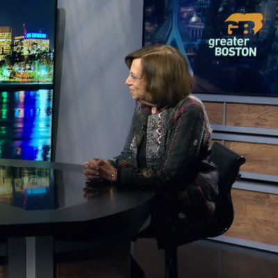 Carol Saivetz and Gautam Mukunda sitting in the GBH news room