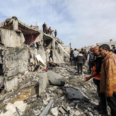 Palestinians carry out search and rescue operations among rubble after Israeli airstrikes