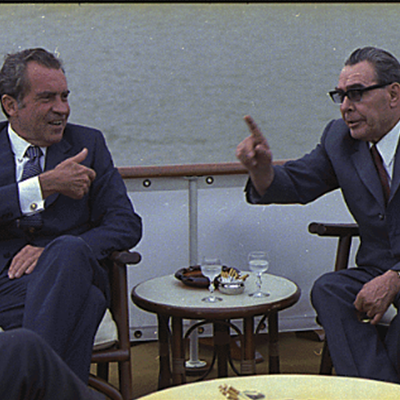 37th U.S. President Richard Nixon having a discussion with a political figure.