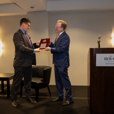 Taylor Fravel hands the Doolittle Award to John Plumb.