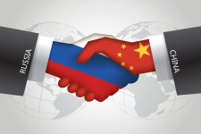 Hands with China and Russia flags shaking