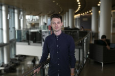 Austin Cooper standing on the second floor of a building